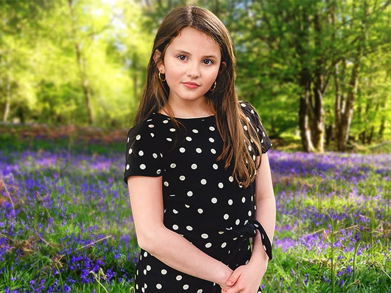 portrait of girl in woodland scene with bluebells by Fife Photographer